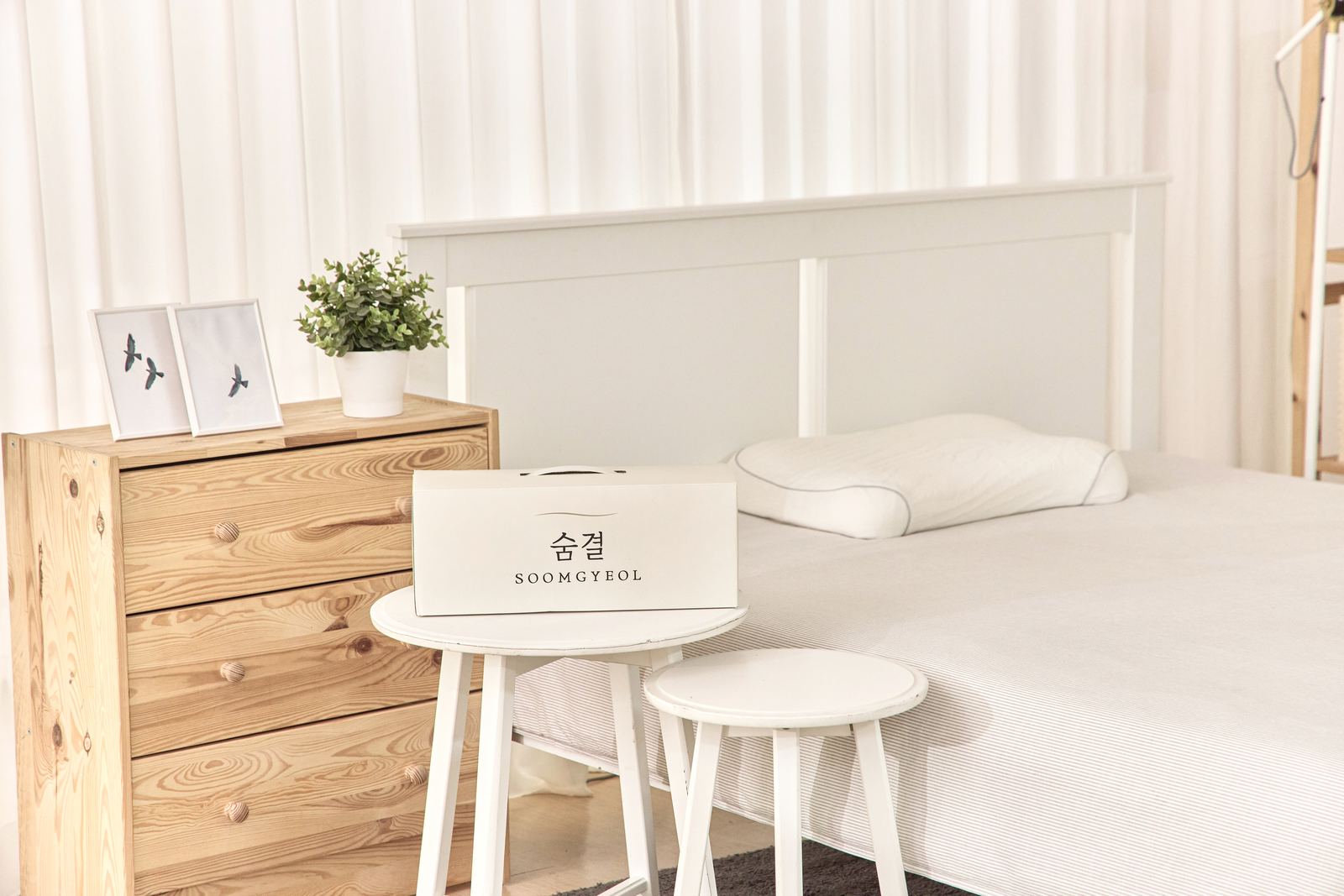 SOOMGYEOL SHIM package in a bedroom